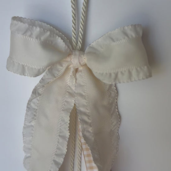 Ribbon Journal - Chloe: 1.5in ivory scalloped edge ribbon with beige gingham center ribbons. $25 each. © Foshee Design Studio 2024